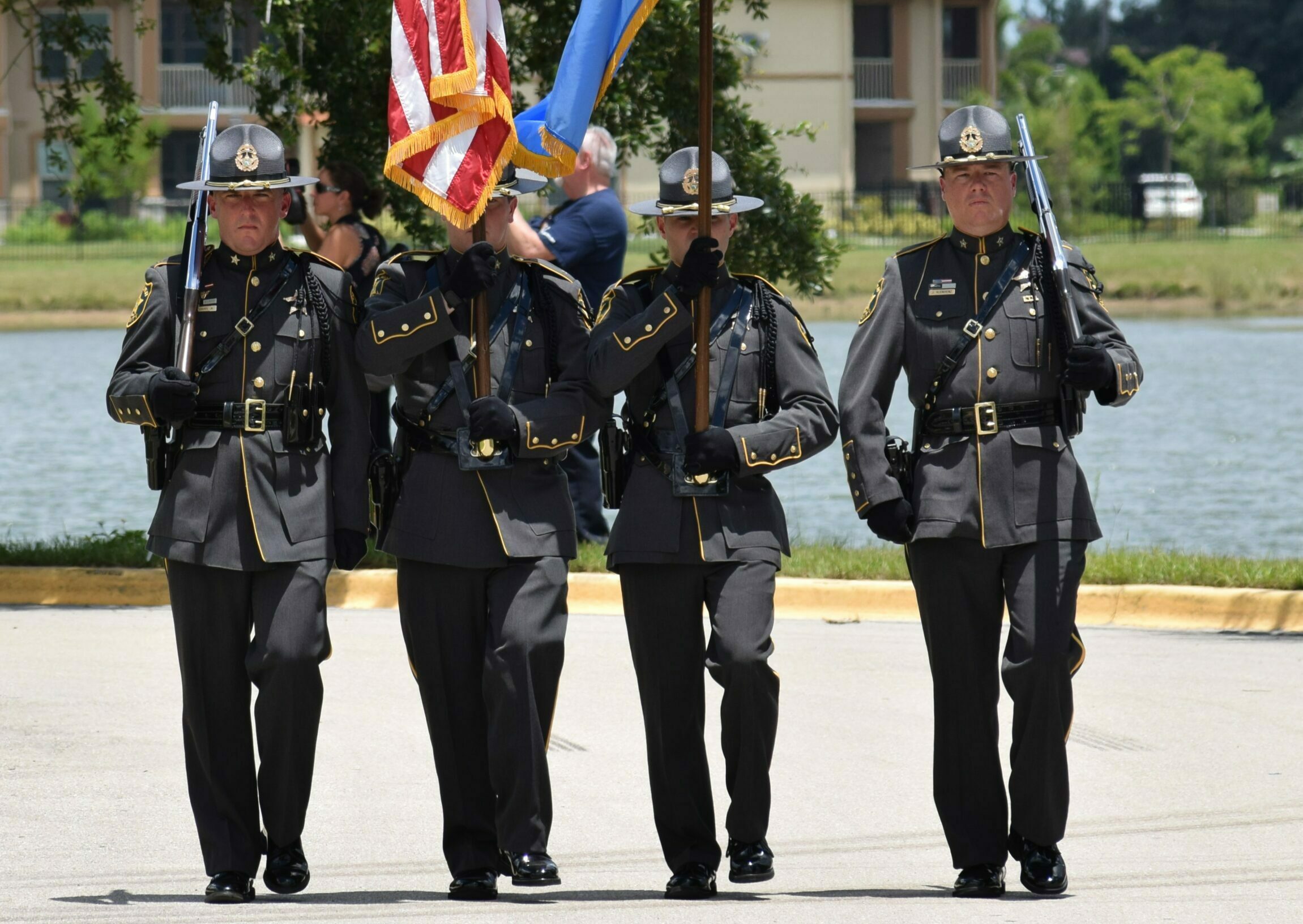 Honor Guard a group of people in uniform holding flags