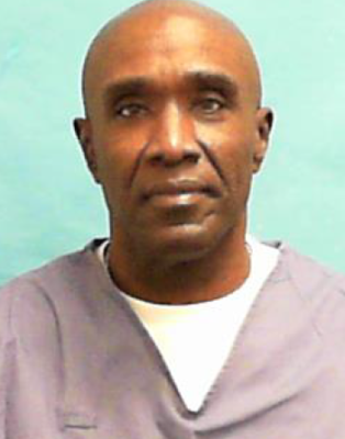 Moore a man with a white shirt