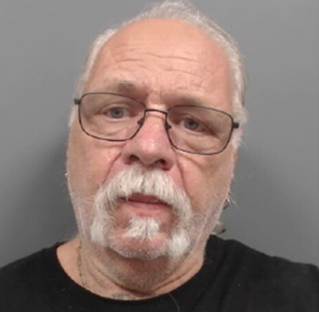 cropped-sparks.png a man with a white beard and glasses