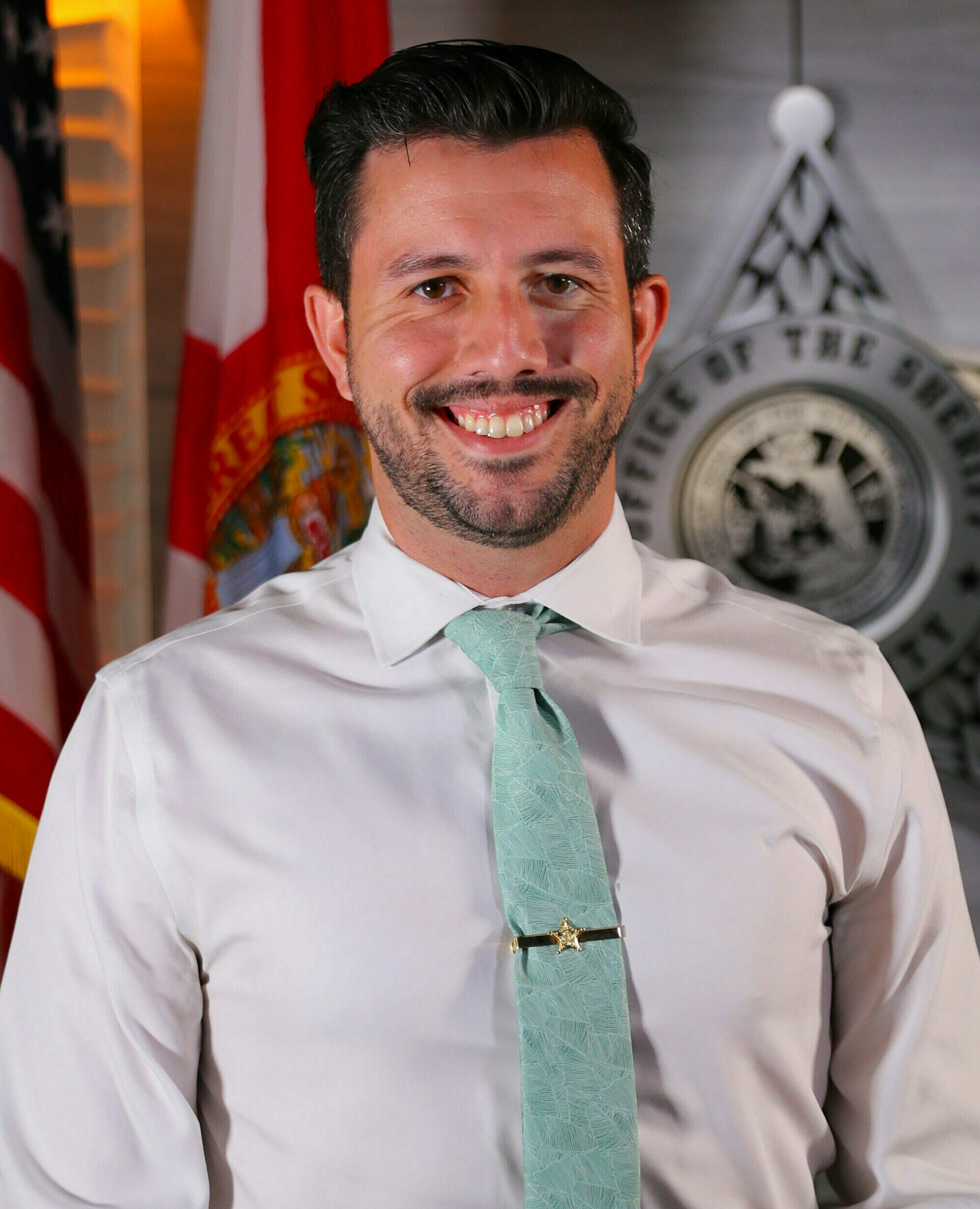 a man in a suit smiling